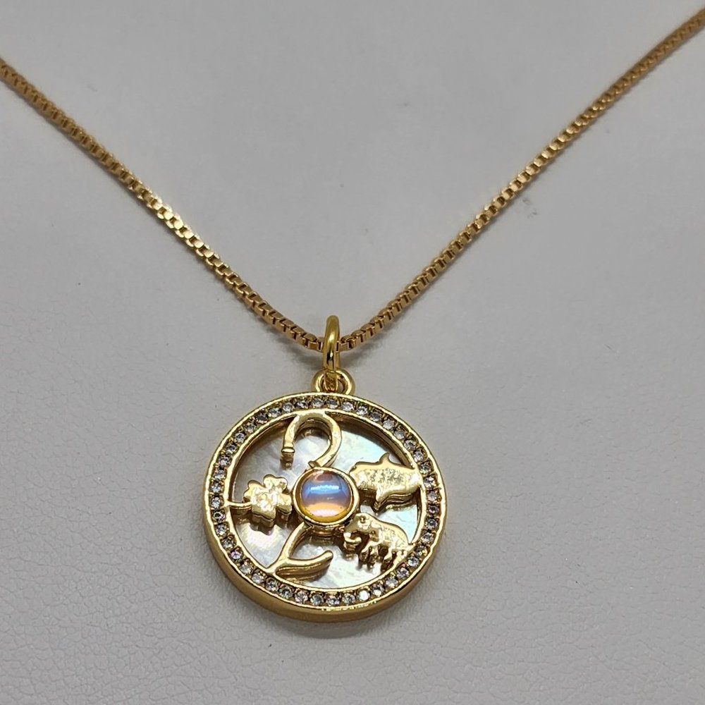 Gold Pendant Necklace with Opalescent Center